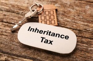 house key with keychain saying inheritance tax