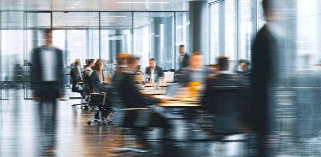 blurred photo of people in office setting