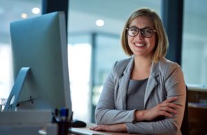 businesswoman sitting at desk in office