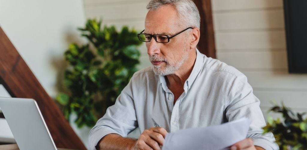 older man at laptop